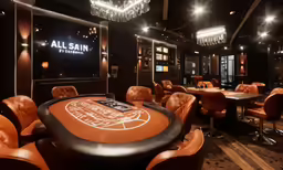a gambling room decorated in orange chairs and a table