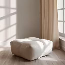 a chair on wooden floor next to windows