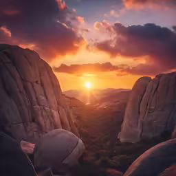 the sun is setting behind the rocky mountains