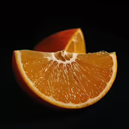 there is a slice of orange sitting on the table
