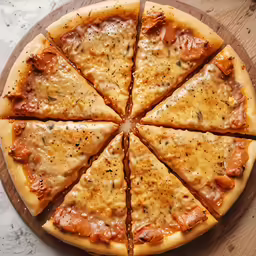 pizza sliced into eight slices on a wooden board