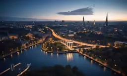 the city lights shine on the river and bridge