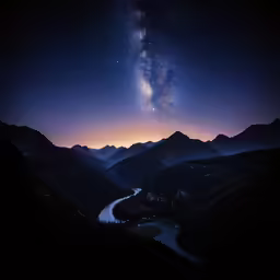 a night time sky full of stars and a stream of water