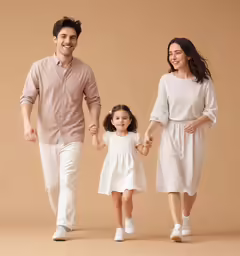 a woman, man and girl are walking together in the studio