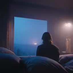 a person is looking out of an open window