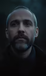 a man with a goatee and black shirt