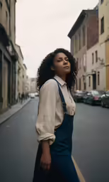 a woman is standing on a street with an apron