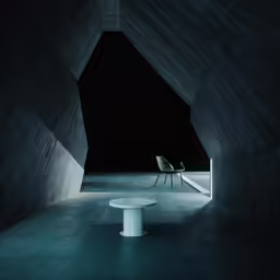 a dark and stormy room with a chair