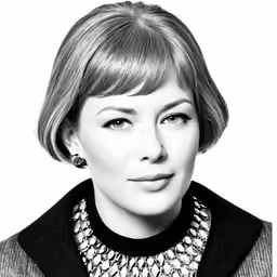 a black and white photo of a woman in a suit