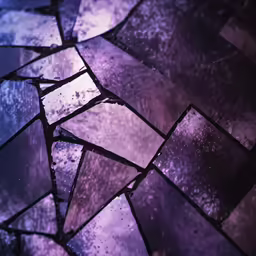 a piece of glass containing different colored tiles