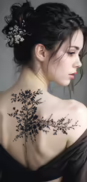 a woman with a flower tattoo on her back