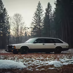 the station wagon has all black rims on it