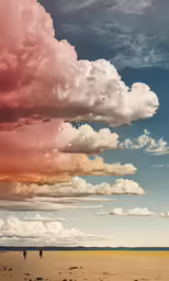 a cloud covered sky has people walking beneath it