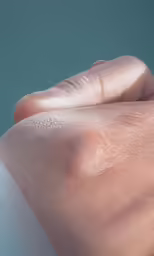 an arm that is shiny with white spots