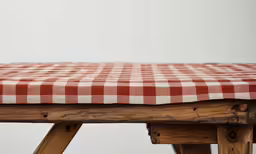 a table top with a checkered tablecloth on it