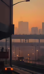 a foggy street and some cars and bridges