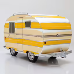 a tiny yellow and white trailer sitting on a white surface