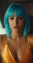 a young lady wearing a tan bra and bright turquoise hair