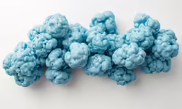 an array of blue clouds on a white surface