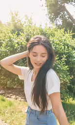 a woman posing for the camera with her hands to her hair
