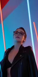 a woman in a black jacket and sunglasses