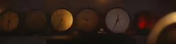 clock faces on the wall at night lit up