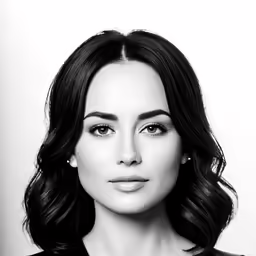 a black and white photo of a woman with long hair