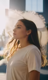 a beautiful woman standing in front of a city street