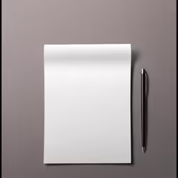 an empty paper with a pen and a pen on top