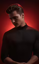 a man with a pompk undercut looking down