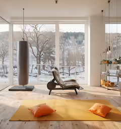 a living room with large glass doors, chair and rug