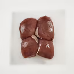 small pieces of meat on top of a white plate