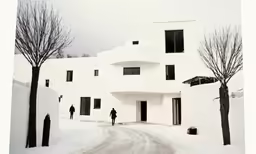 some people are walking down a snowy path