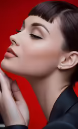 a woman is posing for a picture with her eyes closed