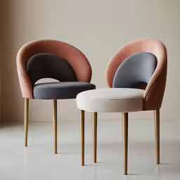 a pair of chairs in black, white, and orange