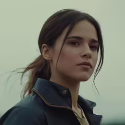a close up of a person in a leather jacket