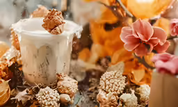 a table holding flowers, pine nuts, and other things
