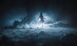 a lone figure walks through the foggy area