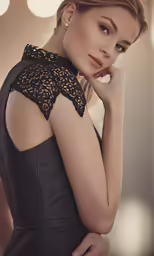 a woman with blonde hair poses for a portrait