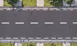 top down view of an empty street and grass