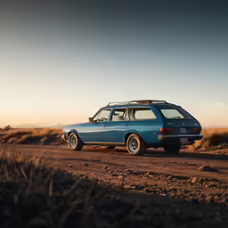 an old car sitting in the middle of a field