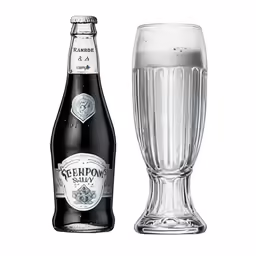a half empty beer bottle next to a full glass