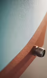 a camera is sitting on the side of a wall