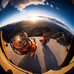 two vehicles are in the viewfinder, one orange and another blue