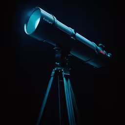 a telescope on a tripod with a bright light at the top