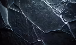 a close up of some large rocks with a dark background