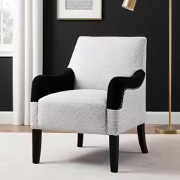 a chair with a black base, in the middle of a room