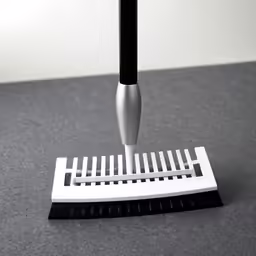 a small black and white pen sitting on top of a clipboard