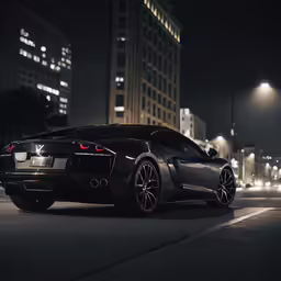 a black sports car is on the street at night