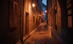 street lights in an old town street with stone walkway
